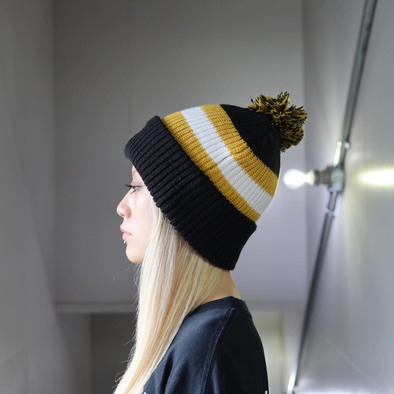 BRIXTON / KIT POM BEANIE (BLACK/OFF WHITE/BRIGHT GOLD)