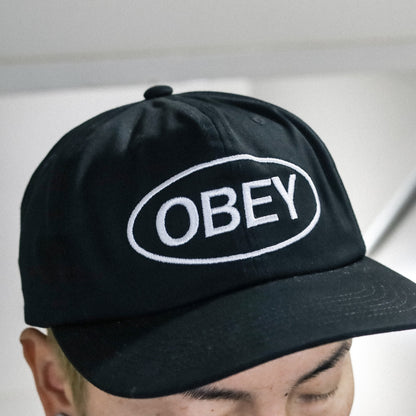 OBEY / OVAL 6 PANEL STRAPBACK CAP (BLACK)